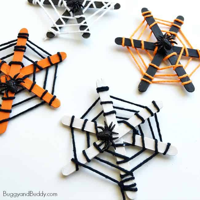 Popsicle stick and yarn spider webs by Buggy and Buddy