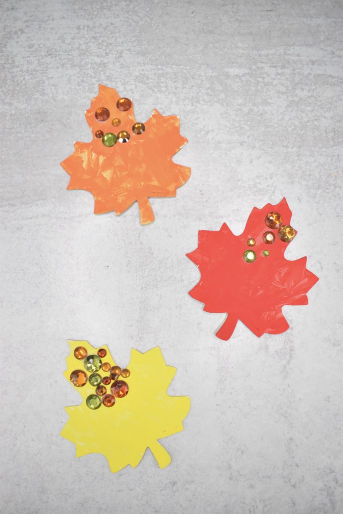 Painted leaves with jewel faces