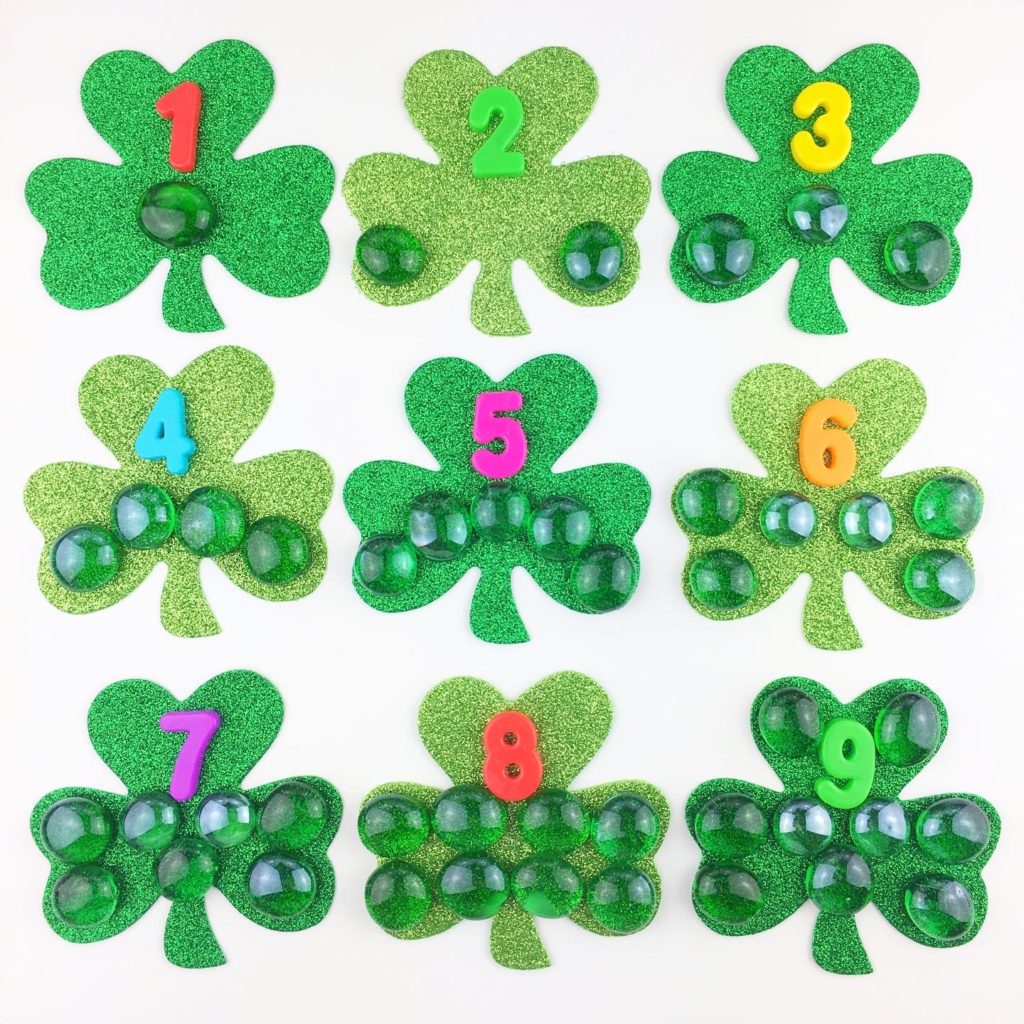 nine shamrocks with glass gems and corresponding numbers