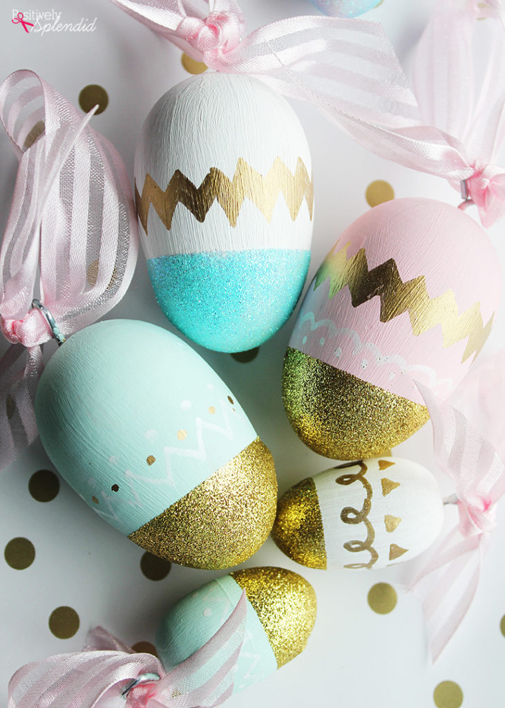 5 wooden painted eggs with gold glitter