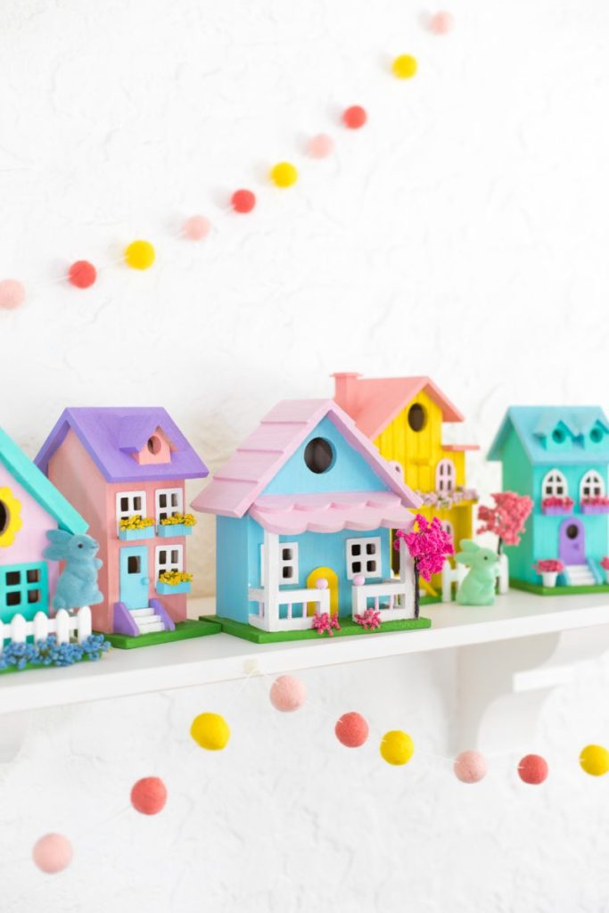 Painted Easter Village houses on a mantle